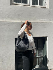 Trendige geflochtene Tasche