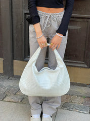 Trendige geflochtene Tasche